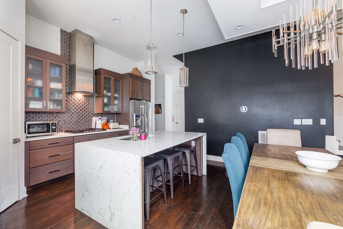 Chef's kitchen with waterfall marble island